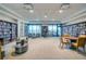Beautiful library featuring well-stocked bookshelves, city views, and comfortable seating at 1 Beach Se Dr # 1902, St Petersburg, FL 33701