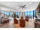 Relax in this comfortable living room with large windows and panoramic water views at 1 Beach Se Dr # 1902, St Petersburg, FL 33701