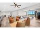 Open-concept living area with modern furnishings, wood floors, and ample seating at 1 Beach Se Dr # 1902, St Petersburg, FL 33701