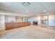 Spacious lobby area with artwork, piano, half wall, and neutral carpeting throughout at 1 Beach Se Dr # 1902, St Petersburg, FL 33701