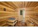 Wooden sauna with a traditional heater and wooden benches at 1 Beach Se Dr # 1902, St Petersburg, FL 33701