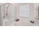 Bright bathroom with a corner soaking tub and a separate glass-enclosed shower provides a spa-like experience at 10263 Devonshire Lake Dr, Tampa, FL 33647