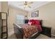 Comfortable bedroom with a ceiling fan, neutral walls, and a cozy bed setup at 10263 Devonshire Lake Dr, Tampa, FL 33647