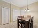 Cozy dining area features a wooden table with seating and natural light at 10263 Devonshire Lake Dr, Tampa, FL 33647