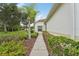 Attractive home featuring lush landscaping and a cozy walkway to the entrance at 10263 Devonshire Lake Dr, Tampa, FL 33647