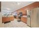 Spacious kitchen with stainless steel appliances, tile flooring, and a view to living spaces at 10263 Devonshire Lake Dr, Tampa, FL 33647