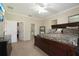 Spacious main bedroom boasts ample closet space, neutral paint, and a luxurious dark wood bed frame and dresser at 10263 Devonshire Lake Dr, Tampa, FL 33647