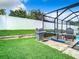 A stainless grill and screened-in pool area highlight this beautiful backyard space at 10713 Shady Preserve Dr, Riverview, FL 33579