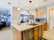 Open-concept kitchen featuring a large island with seating and views into other living areas at 10713 Shady Preserve Dr, Riverview, FL 33579