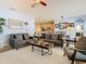 Open-concept living area with neutral tones and comfortable seating at 10713 Shady Preserve Dr, Riverview, FL 33579