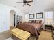 Spacious main bedroom with ceiling fan, ensuite bath and two large closets at 10713 Shady Preserve Dr, Riverview, FL 33579
