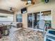 Enjoy the covered patio with an outdoor television and ceiling fans overlooking the pool at 10713 Shady Preserve Dr, Riverview, FL 33579