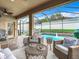Relax on the covered patio with views of the screened pool area, and beautiful landscaping at 10713 Shady Preserve Dr, Riverview, FL 33579