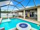 Beautiful screened pool and covered patio with an outdoor kitchen area at 10713 Shady Preserve Dr, Riverview, FL 33579