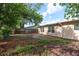 Good-sized backyard with shade trees and a wooden fence offers great privacy at 10841 Casa Grande Ave, Port Richey, FL 34668