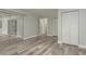 Bedroom with wood floors, sliding glass door and closet at 10841 Casa Grande Ave, Port Richey, FL 34668