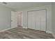Bedroom with wood floors and closet at 10841 Casa Grande Ave, Port Richey, FL 34668