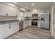 Beautiful kitchen with granite countertops, stainless steel appliances, and modern cabinetry at 10841 Casa Grande Ave, Port Richey, FL 34668
