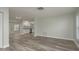 Bright, open-concept living area with modern floors and lots of natural light at 10841 Casa Grande Ave, Port Richey, FL 34668