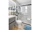 Contemporary bathroom featuring white subway tile shower, grey vanity and modern fixtures at 1115 45Th N St, St Petersburg, FL 33713