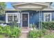 Inviting front entrance with a decorative door, well manicured bushes, and charming exterior details at 1115 45Th N St, St Petersburg, FL 33713