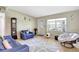 Cozy living room featuring a large window, ceramic flooring, and neutral paint at 1115 45Th N St, St Petersburg, FL 33713
