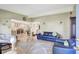Open concept living area with tile flooring, comfortable seating, and a view of the connecting rooms at 1115 45Th N St, St Petersburg, FL 33713