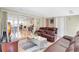 Cozy living room featuring comfortable leather sofas and glass doors to an adjacent living area at 1115 45Th N St, St Petersburg, FL 33713