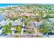 Spacious home with a long driveway and mature trees, surrounded by a well-maintained neighborhood at 112 11Th Ave, Indian Rocks Beach, FL 33785
