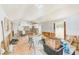 An open living space with wood floors and white-painted ceilings leading into the kitchen at 112 11Th Ave, Indian Rocks Beach, FL 33785