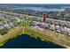 Aerial view of homes located on a lake with private docks and neighborhood playground at 11320 Chilly Water Ct, Riverview, FL 33569