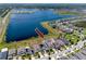 Aerial view showcasing waterfront homes with pools and easy access to a beautiful community lake at 11320 Chilly Water Ct, Riverview, FL 33569