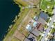 Aerial view of a home with pool and backyard, located on a lake with private dock at 11320 Chilly Water Ct, Riverview, FL 33569