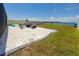 Backyard firepit area with Adirondack chairs, kayaks, and view of the lake at 11320 Chilly Water Ct, Riverview, FL 33569
