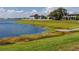 Lakeside backyard featuring a private dock and scenic water views at 11320 Chilly Water Ct, Riverview, FL 33569
