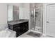 Bathroom with granite countertop vanity, glass enclosed shower, and soaking tub at 11320 Chilly Water Ct, Riverview, FL 33569
