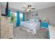 Bright bedroom featuring a ceiling fan, a window view, and marine life decor at 11320 Chilly Water Ct, Riverview, FL 33569