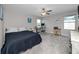 This bedroom has a desk and a ceiling fan, providing a comfortable and functional space at 11320 Chilly Water Ct, Riverview, FL 33569