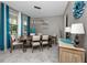 Dining room with rustic wooden table and chairs with light fixture at 11320 Chilly Water Ct, Riverview, FL 33569