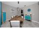 Dining room with a large wooden table, modern chandelier, and stylish decorations at 11320 Chilly Water Ct, Riverview, FL 33569