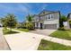 Two-story home with covered entryway, gray siding, and well-manicured lawn at 11320 Chilly Water Ct, Riverview, FL 33569