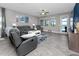 Comfortable living room with neutral walls and view of pool and lake at 11320 Chilly Water Ct, Riverview, FL 33569
