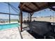 Outdoor kitchen with a grill, perfect for outdoor dining and entertaining at 11320 Chilly Water Ct, Riverview, FL 33569