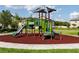 A colorful playground area with slides, climbing structures, and a soft landing surface at 11320 Chilly Water Ct, Riverview, FL 33569