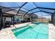 Backyard featuring a sparkling pool and hot tub with a screened enclosure at 11320 Chilly Water Ct, Riverview, FL 33569