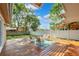 A beautiful backyard with a wooden deck and outdoor seating, perfect for relaxing or entertaining at 11510 92Nd Way, Largo, FL 33773