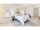 Bright bedroom featuring neutral walls, ample natural light, and neutral decor with white bedding at 11510 92Nd Way, Largo, FL 33773