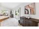 Bright dining area featuring tile flooring, sliding glass doors to the yard, and stylish furnishings at 11510 92Nd Way, Largo, FL 33773
