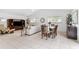 Open-concept living area with tile floors, comfortable seating, and natural light from the windows at 11510 92Nd Way, Largo, FL 33773