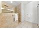 Walk-in shower featuring glass enclosure, tiled walls, and a rain shower head at 11510 92Nd Way, Largo, FL 33773